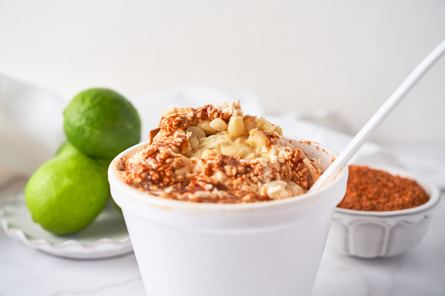 Mexican snack, prepared esquite, corn in a cup, with chili